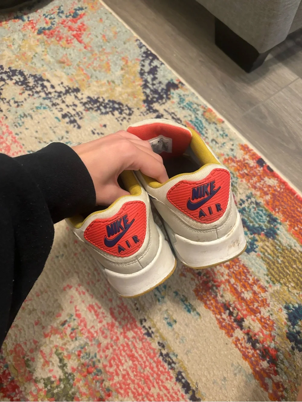 Nike Women's White Sneakers with Blue Swoosh and Yellow Lining